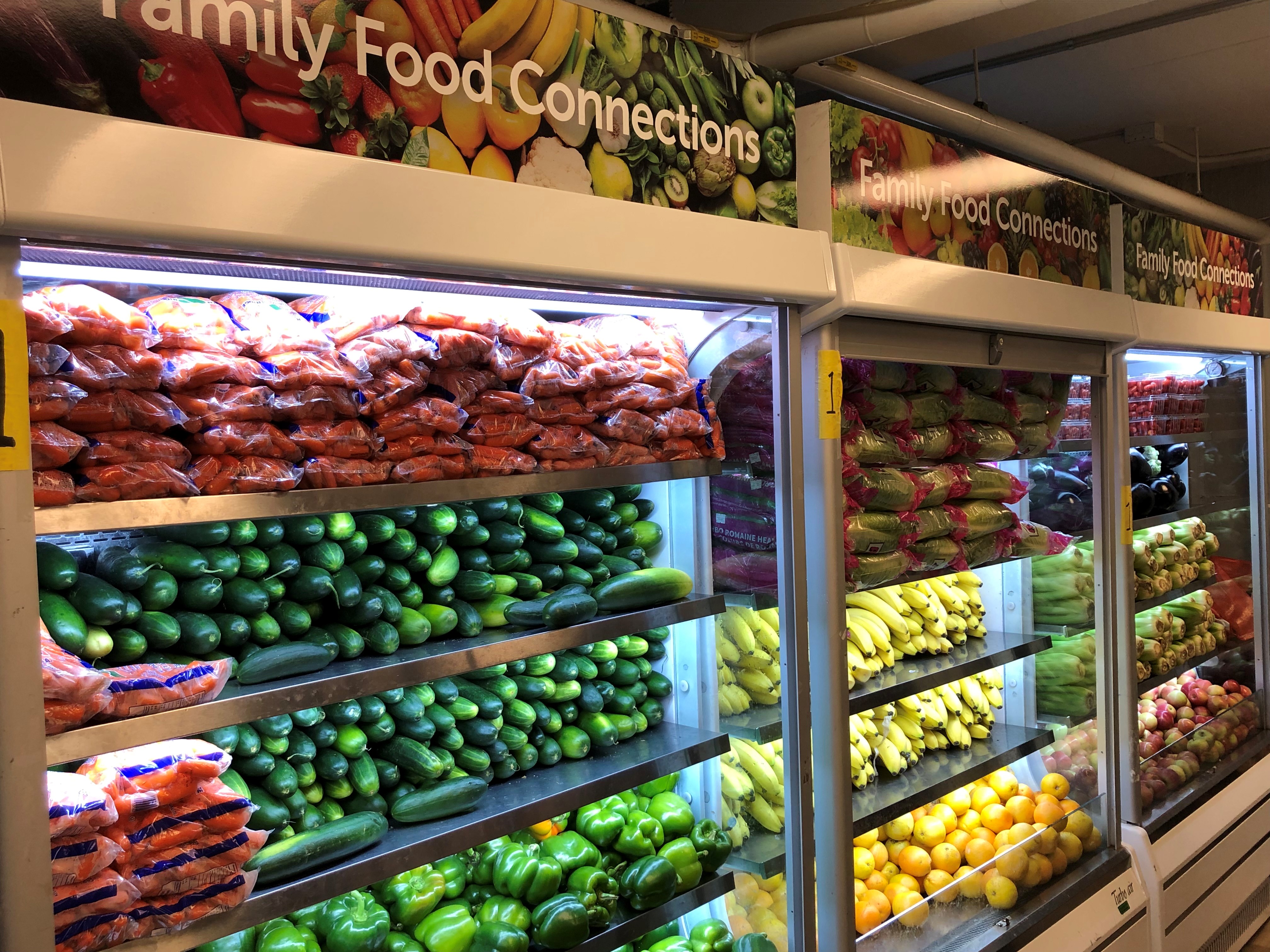 Family Food Connections shelved with various forms of produce.